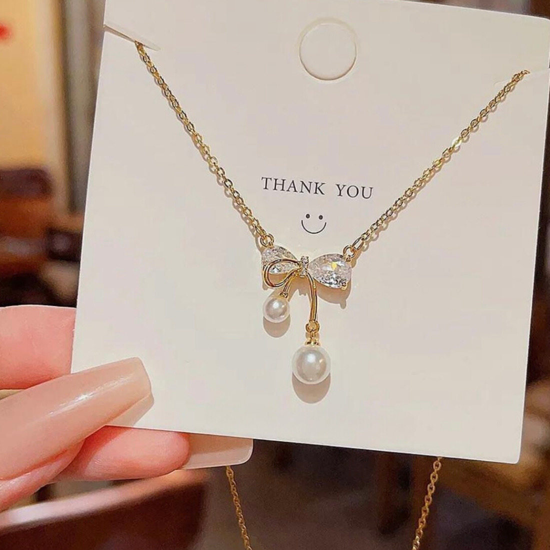 Anti tarnish 18k Gold plated stainless steel bow pendant with chain