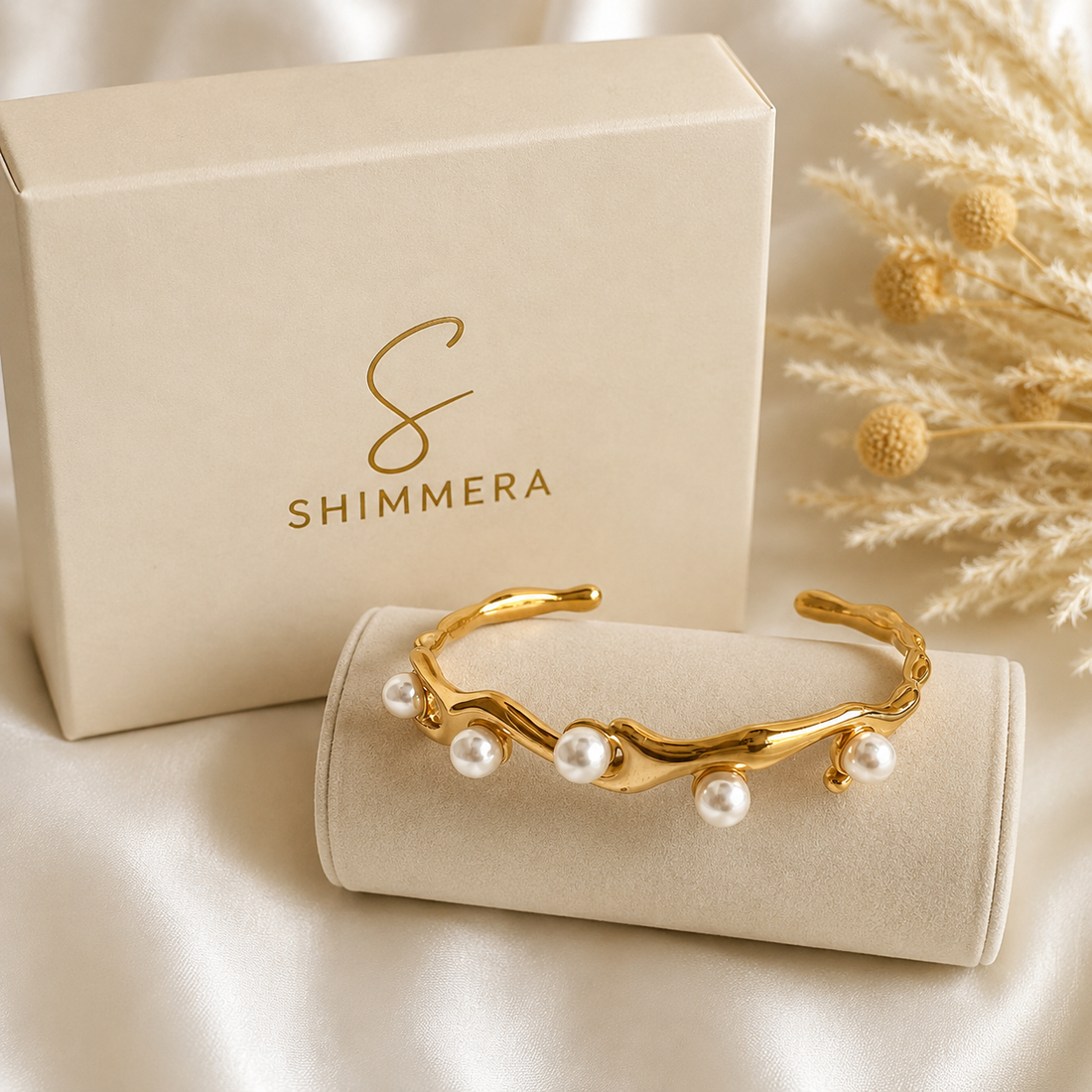 Gold bracelet with pearls on a Shimmera branded box